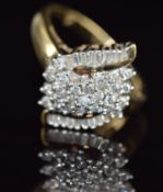 A 9ct gold ring set with baguette and round cut diamonds in a cluster, 3.9g, size N