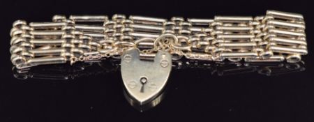 A 9ct gold gate bracelet with heart padlock clasp, 42g, 21cm long