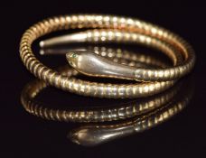 A 9ct gold serpent bangle with glass eyes, 17.2g