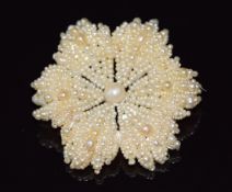 A 19thC seed pearl and pearl brooch threaded in a floral design, 10.4g, 4.5cm