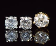Three diamond set earrings comprising 18ct gold example set with an old cut diamond of approximately