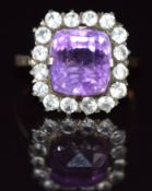 A 9ct gold ring set with a cushion cut amethyst and white sapphires, 4.1g, size J