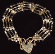 A 9ct gold gate bracelet with heart padlock clasp, 10.8g, 18cm long