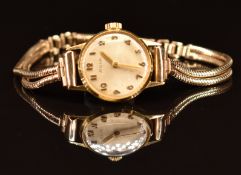 Avia 18ct gold ladies wristwatch with gold hands and Arabic numerals and silver dial, on 9ct gold