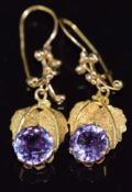 A pair of 9ct gold earrings set with oval cut synthetic purple sapphires, 4g, 2.8cm