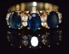 A 14ct gold ring set with sapphires and cubic zirconia, 4.4g, size O