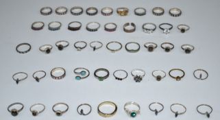 A collection of silver rings including sapphire, ruby, quartz, etc