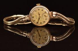 Cyma 9ct gold ladies wristwatch with inset subsidiary seconds dial, gold hands and Arabic numerals