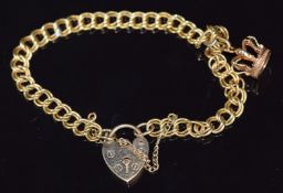 A 9ct gold double link bracelet with heart padlock clasp and 9ct gold crown charm, 9.2g, 18cm long