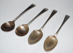 Two Georgian hallmarked silver Old English pattern soup spoons and two table spoons, various dates