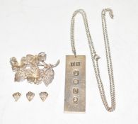 A silver ingot and filigree brooch