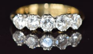 An 18ct gold ring set with five diamonds, each approximately 0.25ct, 3.6g, size P