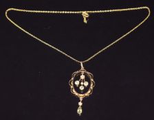 Edwardian pendant set with peridots and seed pearls on 9ct gold chain, pendant 4.6cm and chain 38cm,
