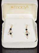 A pair of 14k gold earrings set with pearls and onyx, in original Macy's box