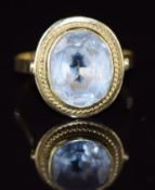 A 14k gold ring set with an oval cut aquamarine, 4.4g, size S