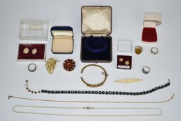A collection of jewellery including three silver rings, rolled gold bangle set with opals, brooches,