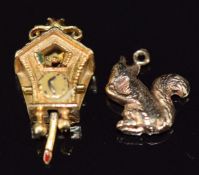 A 9ct gold charm / pendant in the form of a cuckoo clock with moving cuckoo, and a 9ct gold charm in