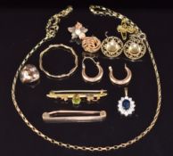 A collection of 9ct gold including brooch set with a peridot and seed pearls, another brooch, chain,