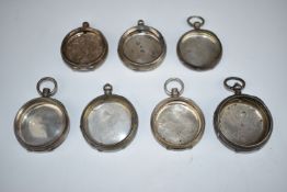 Seven hallmarked and other silver pocket watch cases for keyless and key winding examples, 246g