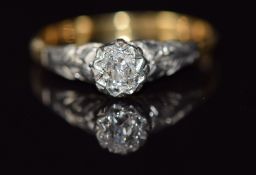 An 18ct gold ring set with an old cut diamond in a platinum setting, 1.9g, size M