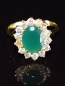 An 18ct gold ring set with paste