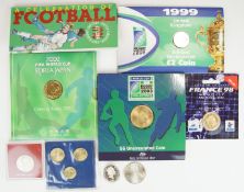 A collection of Royal Mint and other coin souvenir presentation packs, all sporting related