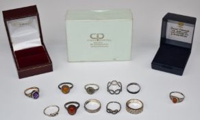 Eleven silver rings including amethyst and amber set
