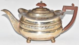 Georgian hallmarked silver teapot with engraved foliate and scrolling decoration and gadrooned edge,