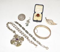 A collection of silver jewellery including bangle, ring, brooch and bracelet, a lizard brooch,
