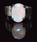 Chinese 18ct white gold ring set with an opal cabochon, 2.6g, size H