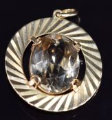 An 18ct gold pendant set with an oval cut quartz, 3.4cm, 12.8g