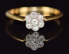 An 18ct gold ring set with diamonds in a cluster, 2.3g, size P