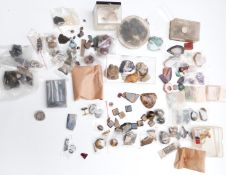 A collection of loose tiger's eye, agate, malachite, amethyst, pyrite, sodalite, etc