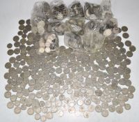 Approximately 9.8kg of UK post 1947 two shilling pieces