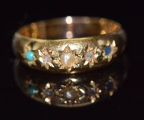 An 18ct gold ring set with seed pearl, diamonds and a turquoise, Birmingham 1891, 2.3g, size N/O