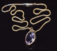 A 9ct gold pendant set with an oval cut amethyst of approximately 15ct, on 9ct gold chain, 7.8g