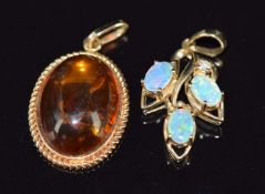 Two 9ct gold pendants, one set with pressed amber (2.5cm)  the other opals and a diamond, 2cm, 4.5g