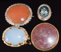 Four Victorian brooches, three set with agate and one with pietra dura