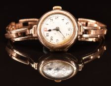 Unnamed 9ct gold ladies wristwatch with blued hands, black Arabic numerals and white enamel dial, on
