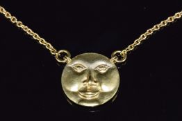 A gold plated bespoke man in the moon face pendant on chain