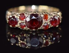 A 9ct gold ring set with garnets, 2.3g, size M