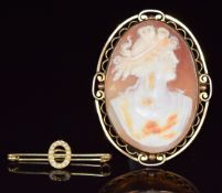 A 9ct gold brooch set with a cameo (4 x 5.5cm) and an Edwardian buckle brooch set with seed