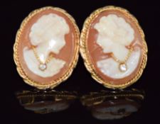A pair of 14k gold earrings set with a cameo and diamonds, 4.8g