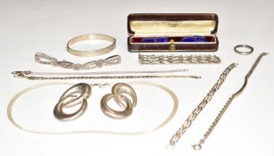 A collection of silver jewellery including earrings, bangle, cufflinks, bracelets and ring
