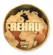 2001 gold coin marked 986 for REHAU Ltd, Ross on Wye, GB 8.6g, 2.5cm diameter, in original