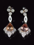 A pair of 18k white gold earrings set with a pear cut topaz and diamonds, 5.5g, 2.8cm