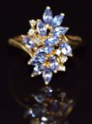 A 9ct gold ring set with tanzanites and diamonds, 2.2g, size J