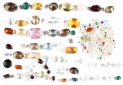 A collection of loose quartz, citrine, paste, emerald, heart cut fire opal, etc