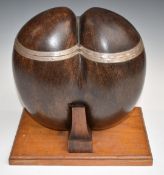 A late 19th/20thC Coco de Mer hinged casket with white metal mounts, raised on a purpose built