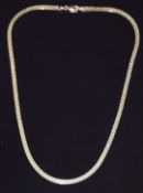 A 9ct gold ribbon necklace with Greek key decoration, 6g, 38cm
